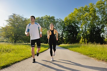 Image showing Young couple jogging