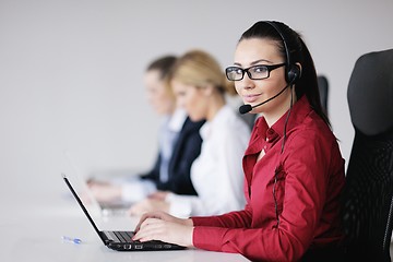 Image showing business woman group with headphones