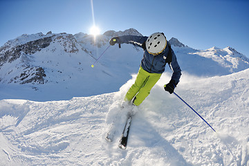 Image showing skiing on fresh snow at winter season at beautiful sunny day