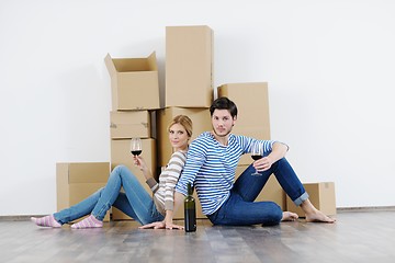 Image showing Young couple moving in new house