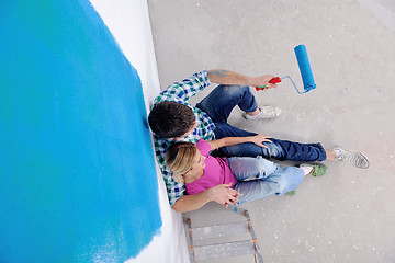 Image showing happy young cople relaxing after painting in new home