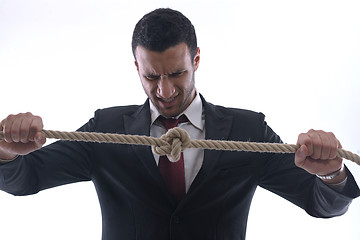 Image showing business man with rope isolated on white background