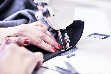 Image showing Hands of Seamstress Using Sewing Machine