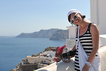 Image showing Greek woman on the streets of Oia, Santorini, Greece