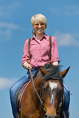 Image showing happy woman  ride  horse