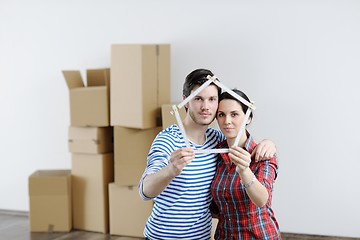 Image showing Young couple moving in new house