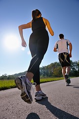 Image showing Young couple jogging