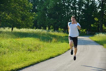 Image showing Young couple jogging at morning