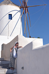 Image showing Greek woman on the streets of Oia, Santorini, Greece