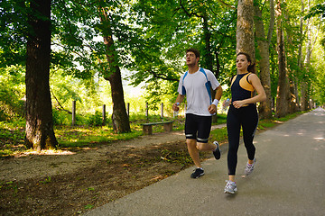 Image showing Young couple jogging