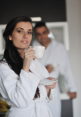 Image showing Young love couple taking fresh morning cup of coffee