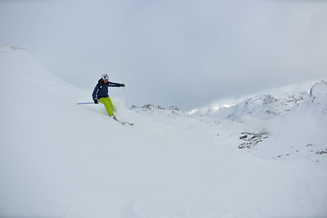 Image showing skiing on fresh snow at winter season at beautiful sunny day