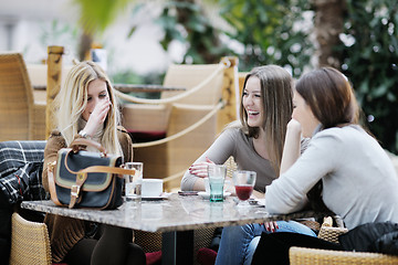 Image showing cute smiling women drinking a coffee