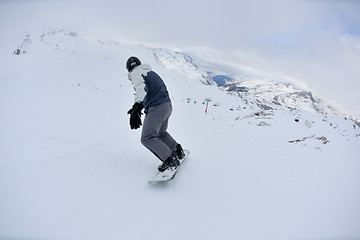 Image showing skiing on fresh snow at winter season at beautiful sunny day