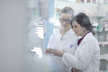 Image showing team of pharmacist chemist woman  in pharmacy drugstore