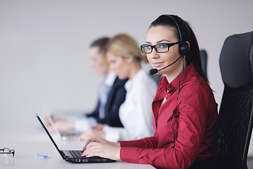 Image showing business woman group with headphones