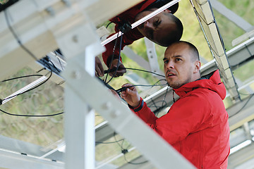 Image showing Male solar panel engineer at work place