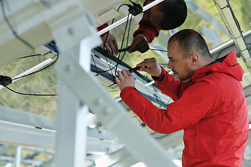 Image showing Male solar panel engineer at work place