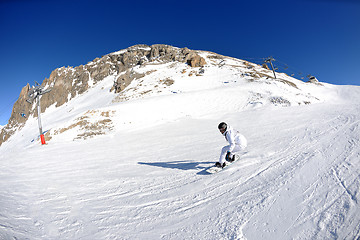 Image showing skiing on fresh snow at winter season at beautiful sunny day