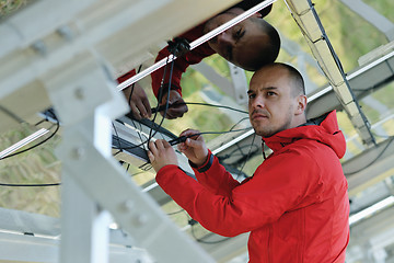 Image showing Male solar panel engineer at work place