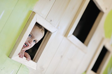 Image showing happy child in a window