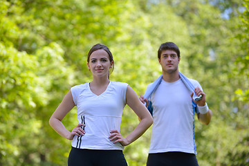 Image showing Couple doing stretching exercise  after jogging