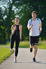 Image showing Young couple jogging at morning