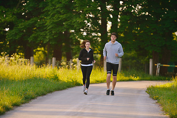 Image showing Young couple jogging