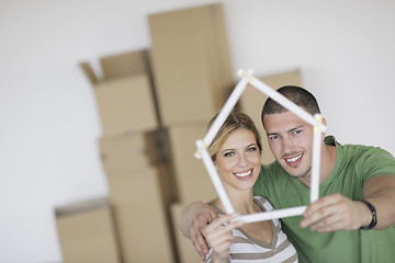 Image showing Young couple moving in new home