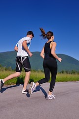 Image showing Young couple jogging