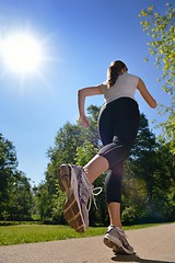 Image showing Young beautiful  woman jogging at morning in park