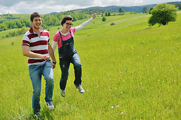 Image showing Portrait of romantic young couple smiling together outdoor