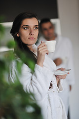 Image showing Young love couple taking fresh morning cup of coffee