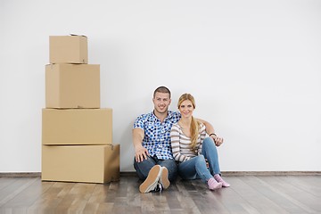 Image showing Young couple moving in new home