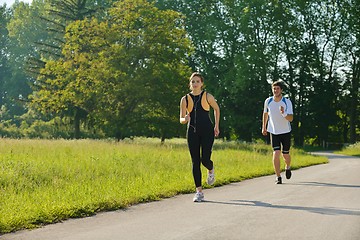 Image showing Young couple jogging at morning