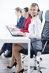 Image showing business woman group with headphones