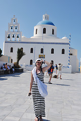 Image showing Greek woman on the streets of Oia, Santorini, Greece