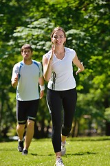 Image showing Young couple jogging at morning