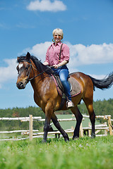 Image showing happy woman  on  horse