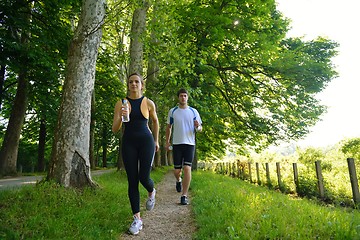 Image showing Young couple jogging