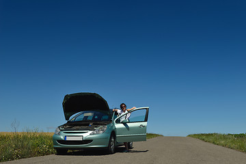 Image showing woman with broken car