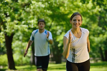 Image showing Young couple jogging