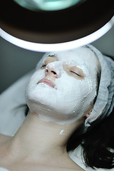 Image showing woman with facial mask in cosmetic studio