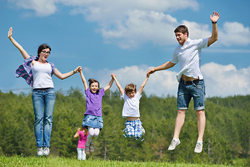 Image showing happy young family have fun outdoors