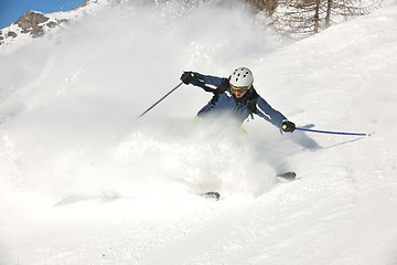 Image showing skiing on fresh snow at winter season at beautiful sunny day