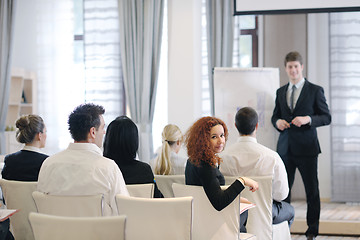 Image showing Young  business man giving a presentation on conference