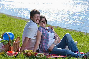 Image showing happy young couple having a picnic outdoor