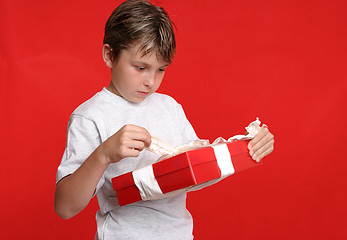 Image showing Child opening a present