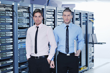 Image showing it enineers in network server room