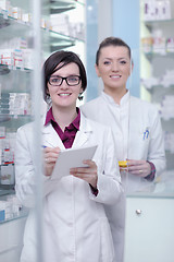 Image showing team of pharmacist chemist woman  in pharmacy drugstore